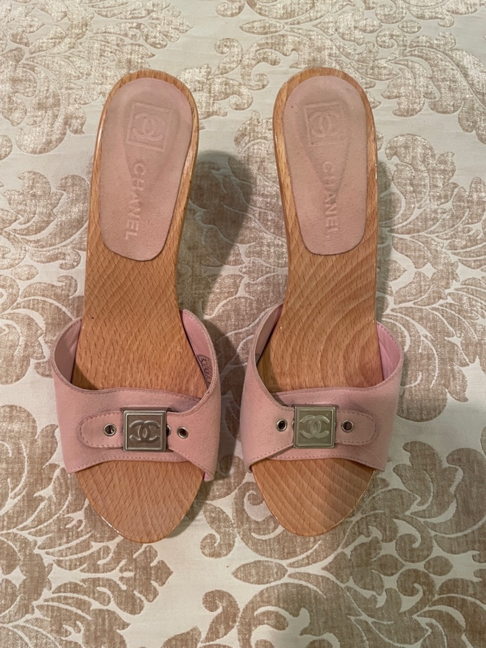 CHANEL Pink Leather Slide Mules with Silver CC Plaques. They are suede. Great